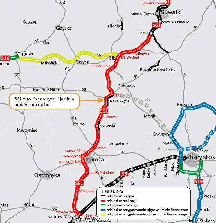 Mapa drogowa północno-wschodniej Polski przedstawiająca przebieg trasy Via Baltica. Czerwoną linią zaznaczono drogę ekspresową S61. W centralnym punkcie znajduje się pomarańczowa ramka informująca o oddaniu do ruchu drugiej jezdni obwodnicy Szczuczyna. Widoczna jest również legenda z oznaczeniami statusu poszczególnych odcinków dróg.